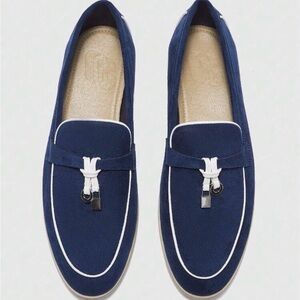 Step out in style with these sleek navy loafers 
Size 8.5